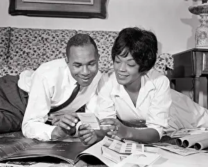 Expressions Prints: 1960s AFRICAN-AMERICAN COUPLE MAN WOMAN HUSBAND WIFE LOOKING AT BLUEPRINTS COLOR SWATCHES PLANNING A NEW HOUSE HOME