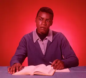 Thoughtful Prints: 1960S African American Student Studying Textbooks