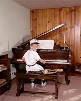 Sound Prints: 1960S Boy Playing Piano Wearing Baseball Uniform