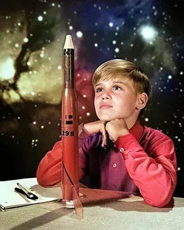 Innovation Prints: 1960s DAY DREAMING BOY WITH MODEL ROCKET AND OUTER SPACE BACKGROUND