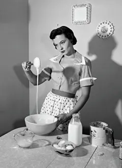Flour Prints: 1960S Housewife Mixing Sticky Batter In Kitchen