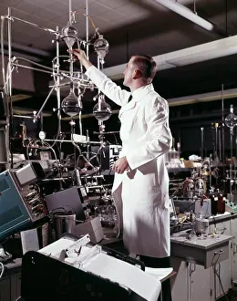 Technician Prints: 1960S Laboratory Technician Conducting A Titration Test Science Experiment Elaborate Precision