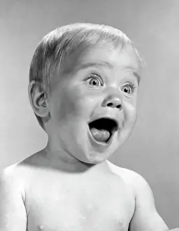 1960S Portrait Baby With Eyes And Mouth Wide Open