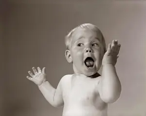 Wide Prints: 1960S Portrait Baby With Hands In Air And Eyes & Mouth Wide Open