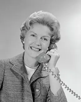 Speaking Prints: 1960S Portrait Smiling Mature Woman Talking On Telephone