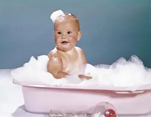 Soap Prints: 1960S Smiling Baby Sitting In Bathtub Bubble Bath Covered With Soap Bubbles