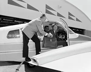 Oldtime Prints: 1960s SMILING BUSINESSMEN IN CESSNA 310G TWIN ENGINE AIRPLANE MAN HANDING LEATHER BRIEFCASE TO PASSENGER