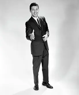 Greeting Prints: 1960S Smiling Full Length Portrait Man Business Man With Hand Extended In Greeting For Handshake