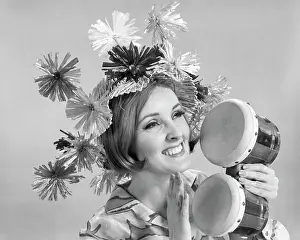 Drums Prints: 1960s SMILING WOMAN WAEARING GOOFY STRAW HAT PLAYING BONGO DRUMS