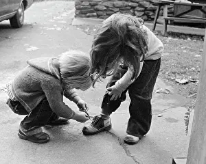 Oldtime Prints: 1970s 1970s BLOND BOY BENDING OVER HELPING GIRL TIE HER SHOE