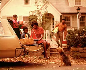 Small Group Of People Prints: 1970S African-American Family Loading Station Wagon Picnic Dog Mother Father Boy Girl Suburban House