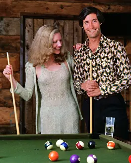 Manly Prints: 1970s COUPLE AT BILLIARD POOL TABLE IN RECREATION ROOM SPORTS MAN WOMAN