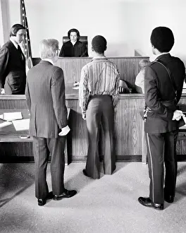 Diverse Prints: 1970s COURTROOM SCENE AFRICAN-AMERICAN TEEN BOY STANDING BEFORE FEMALE JUDGE WITH BAILIFF AND ATTORNEY
