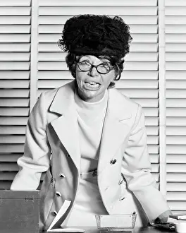 Oldtime Prints: 1970s CRAZY BUSINESSWOMAN AT OFFICE DESK WEARING HAT EYEGLASSES DISHEVELED ANGRY FACIAL EXPRESSION LOOKING AT CAMERA