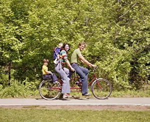 Bicycle Prints: 1970S Family On Tandem Bicycle Mother Father Son Back Seat Baby Daughter Backpack Wearing Bellbottom Blue Jeans