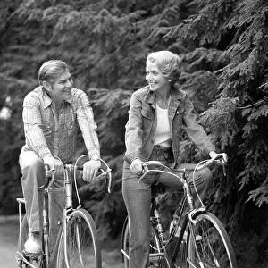 Biking Prints: 1970S Happy Smiling Active Mature Middle-Aged Couple Riding Bicycles Bikes Pine Wooded Trail Activity Sports Retire