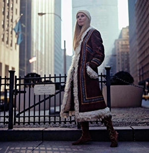 Coats Prints: 1970s lifestyle and fashion. A young woman wearing a typical 1970s coat