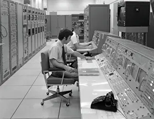 1970S Two Men Sitting At Console Computer Room Mission Control Center Houston Texas Usa