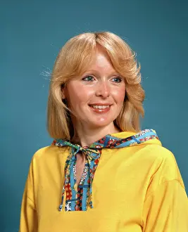 People Adults Prints: 1970S Portrait Smiling Blond Woman Wearing Yellow Hooded Top With Patterned Trim