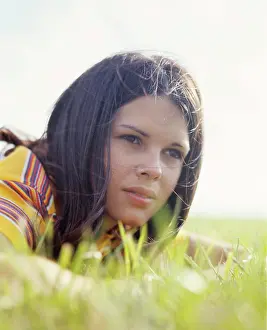 Adolescent Prints: 1970s PORTRAIT TEEN GIRL BRUNETTE LYING IN GRASS