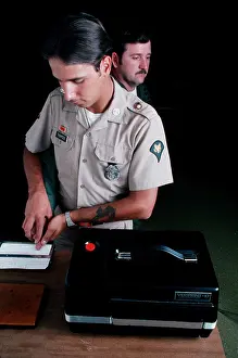 Archives Prints: 1976 - A US Army military policeman takes fingerprints