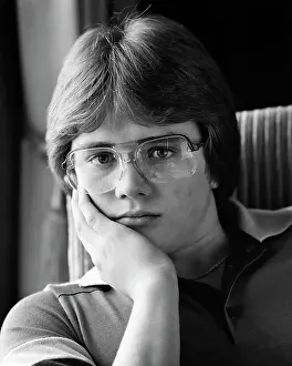 Expressions Prints: 1980s PORTRAIT TEEN BOY LOOKING AT CAMERA WEARING AVIATOR FRAME EYEGLASSES WITH AN UNEMOTIONAL FACIAL EXPRESSION