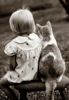 Anonymous Prints: 1980S Rear View Of Little Girl & Cat Sitting Outside On Stool