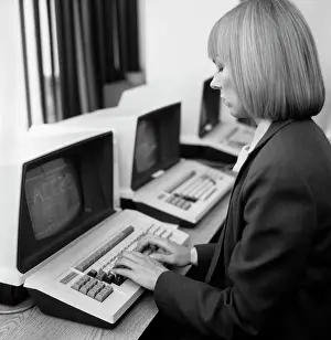 Computers Prints: 1980S Woman In Office At Keyboard From Behind