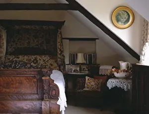 Loft Prints: 19th-century carved half-tester bed with antique crewelwork hangings in attic country bedroom