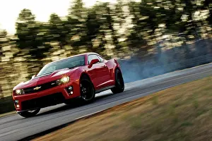 Race Prints: Front 3/4 drifting action of a red 2013 Chevrolet Camaro ZL1 on a rural race track