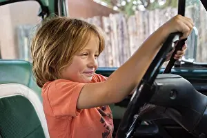 Playful Prints: 5 year old boy behind the wheel of 1970's pick up truckNM