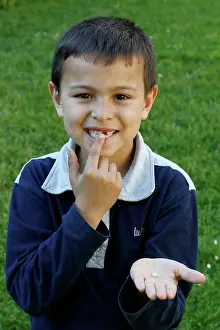 Tooth Prints: 7-year-old boy showing a missing tooth. France