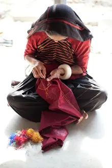 Artisan Prints: Aahir tribeswoman embroidering intricate traditional patterns in very fine chain stitch