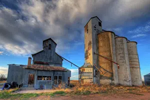 Rural Scene Prints: Abandoned grain elevator and grain silos at the ghost town of Willard