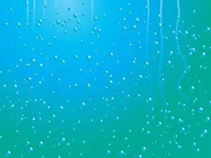 Pink Prints: Abstract raindrop background with tracks of rain that has already raced down the pane