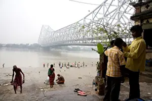 India Prints: Activities on Babu ghat ; Howrah bridge over Hooghly river in background ; Calcutta now Kolkata ; West Bengal ; India