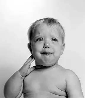 Soft Focus Prints: Adorable baby making a funny expression in black and white portrait