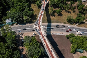 Staedtisch Prints: Aerial drone view of new pedestrian bridge from above Aerial drone view of new pedestrian bridge