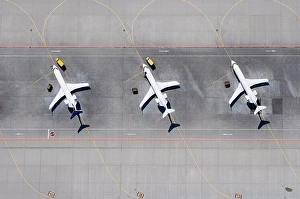 Runway Prints: Aerial view of three airplanes in a row