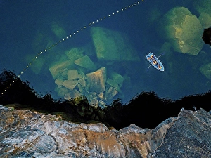 Russian Federation Prints: Aerial view of boat sailing¶ÿover marble boulders sunken in Marble Lake