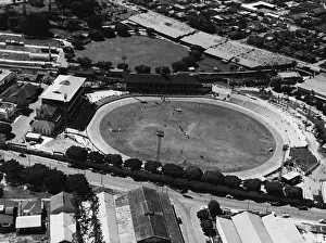 1950 Prints: Aerial view of the Brisbane exhibition ground where the Australian Football Carnival games will be played this week