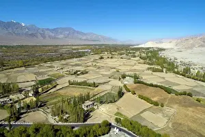 Horizontal Image Prints: Aerial view of cultivation & settlement in fertile Indus river valley fringed by high altitude cold desert