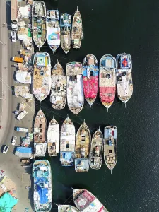 Dubai Prints: Aerial view of The Dubai Dhow Wharfage harbour in United Arab Emirates