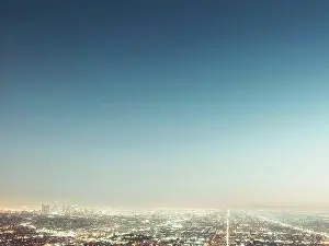Glowing Prints: Aerial view of illuminated cityscape against blue sky, Los Angeles, California, USA