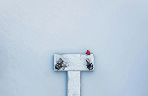 Shapes Prints: Aerial view of people sitting on snowy dock on frozen lake in winter