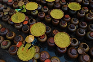 Rice Prints: Aerial view of people working in a factory processing Soya source mixing with yellow rice in barrels
