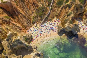 Accessible Prints: Aerial view of Praia do Camilo, hidden beach accessible by steep steps, Portugal