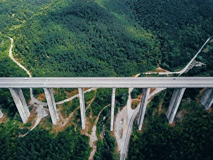 Autool Prints: Aerial view of the road in the mountains over the bridge Aerial view of the road in the mountains over the bridge