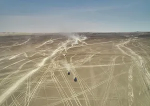 Natural Pattern Prints: Aerial view of vehicular tracks crisscrossing a vast desert landscape