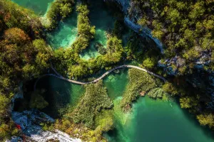 Croatia Prints: Aerial view of a wooden walkway surrounded by turquoise water in Lower Lakes
